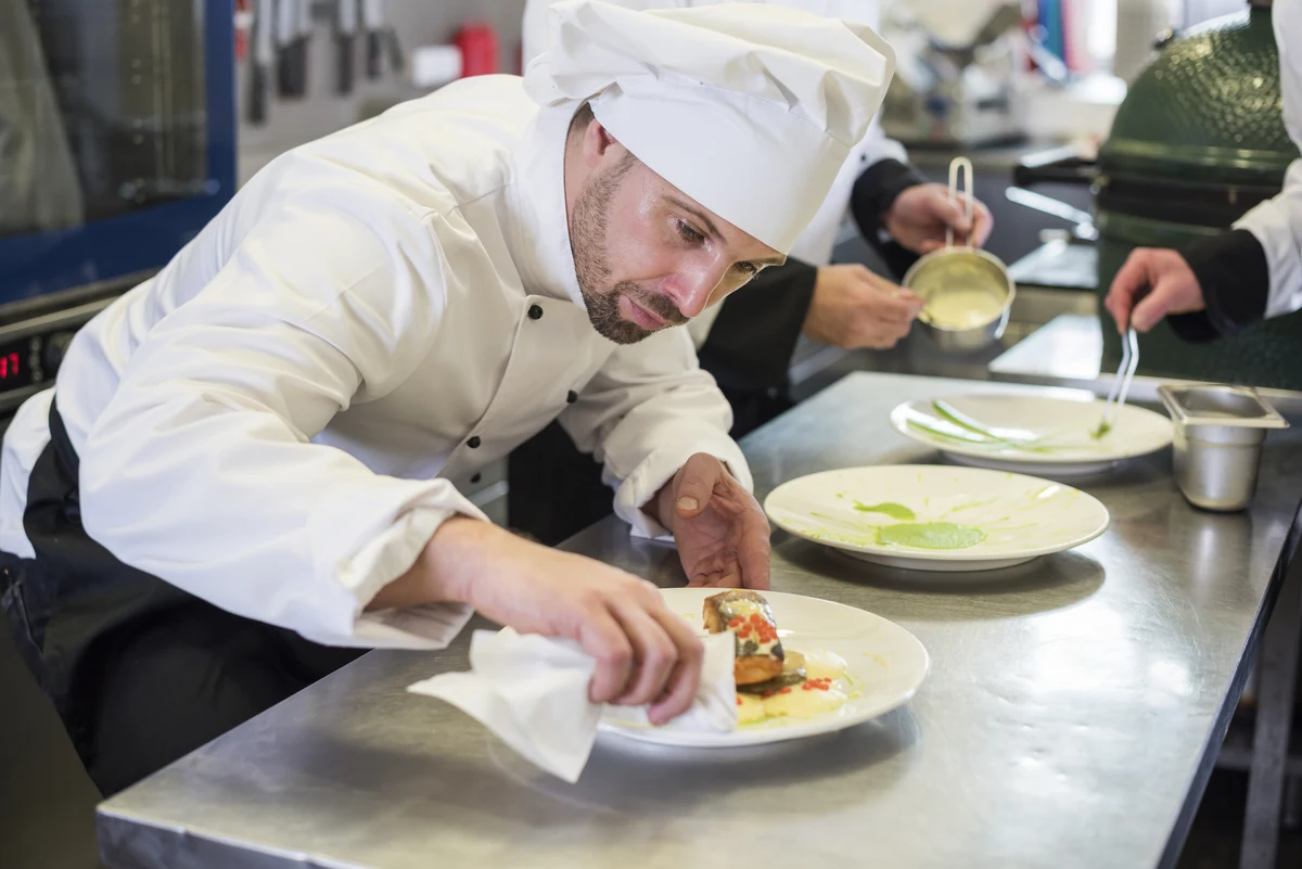 Chef preparing dishes in a professional kitchen