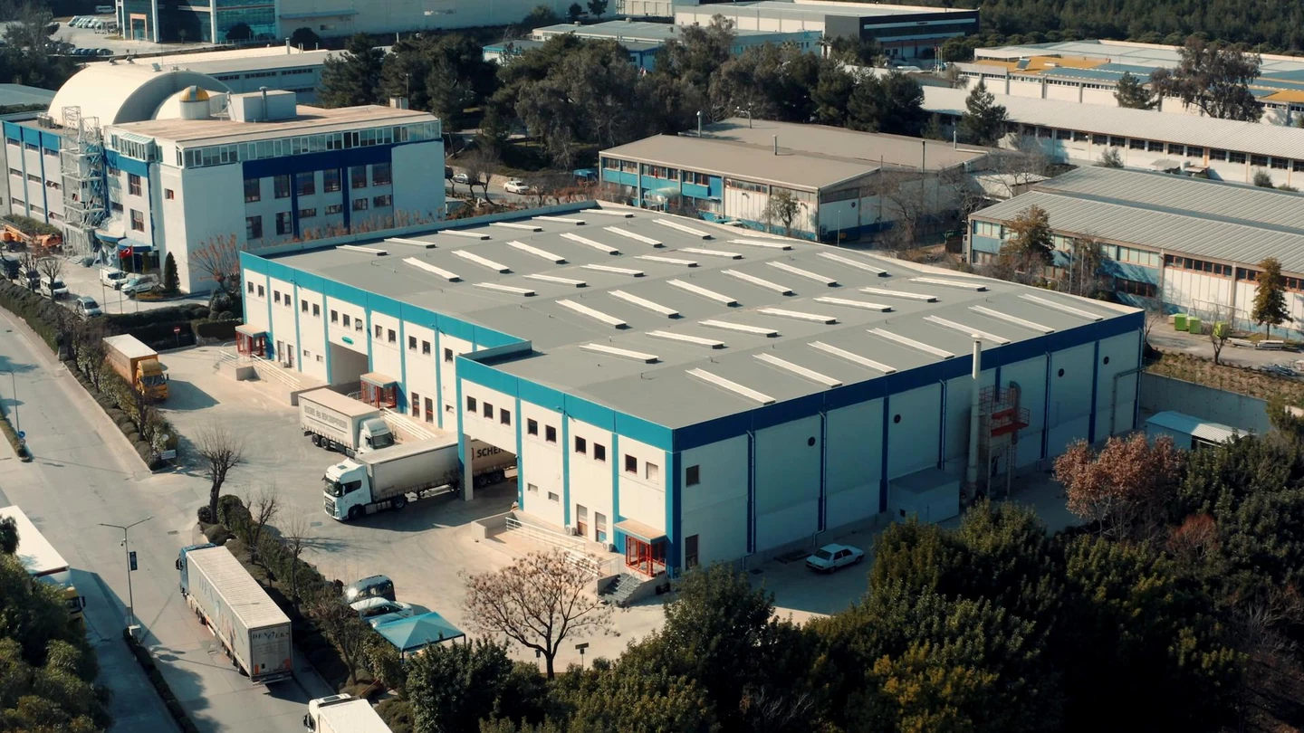 Exterior production-site view from the original FlavourTech company film