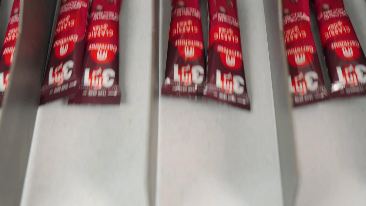 Printed sachets moving along a FlavourTech packing line