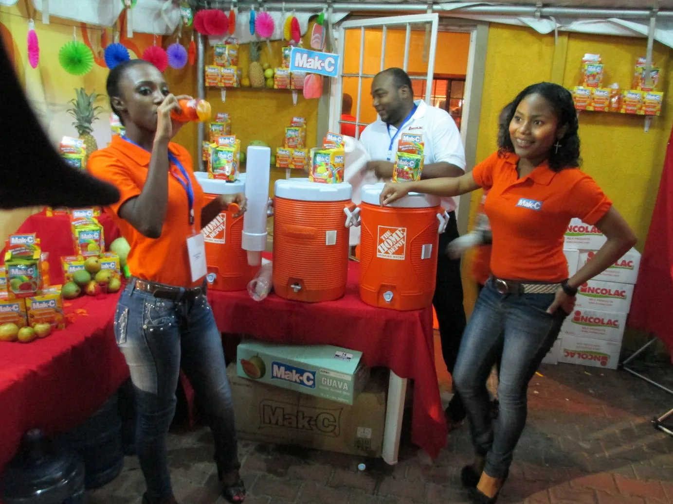 Mak-C promotional team and drink display