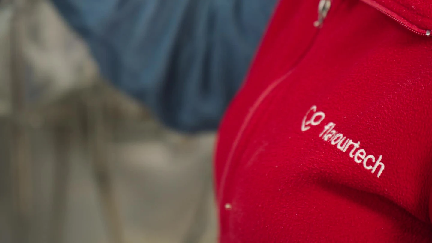 A close detail of the FlavourTech uniform in the company production film