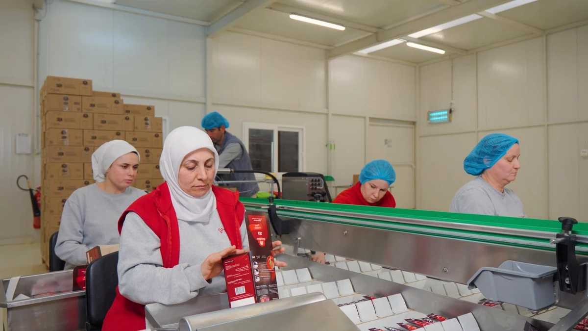 FlavourTech team checking finished packs on the packing line