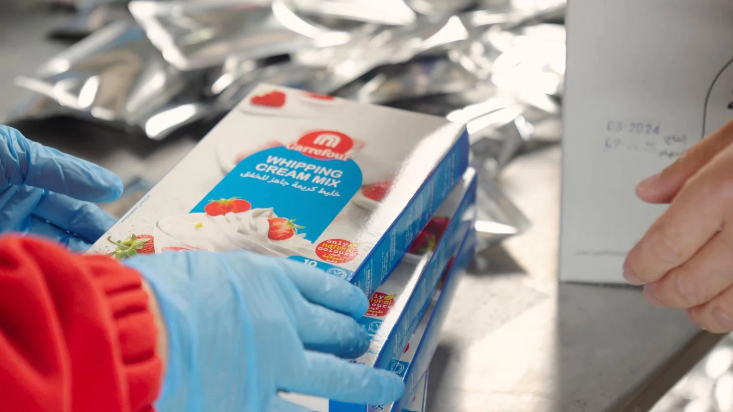 FlavourTech colleagues handling printed product packaging